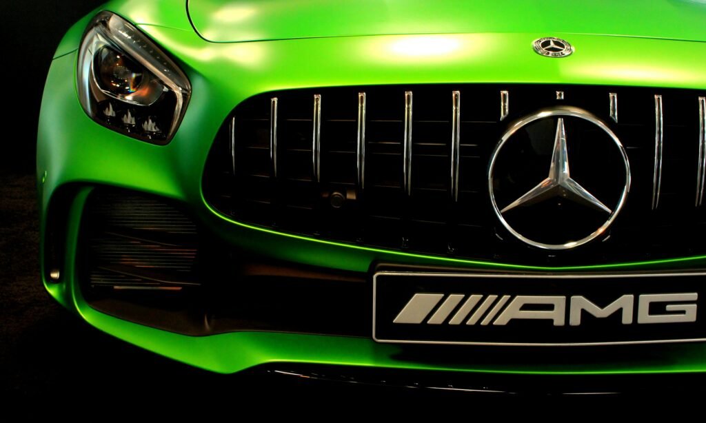 pexels-photo-952338-952338 Close-up of a vibrant green Mercedes AMG grille showcasing the sleek design.