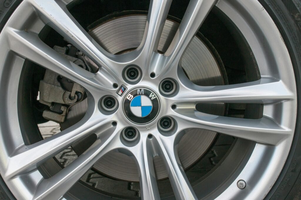 pexels-photo-7985346-7985346 Detailed image of a BMW car wheel rim showcasing intricate design and luxury.